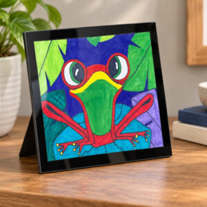 Glass Mount frame with frog artwork on a desk