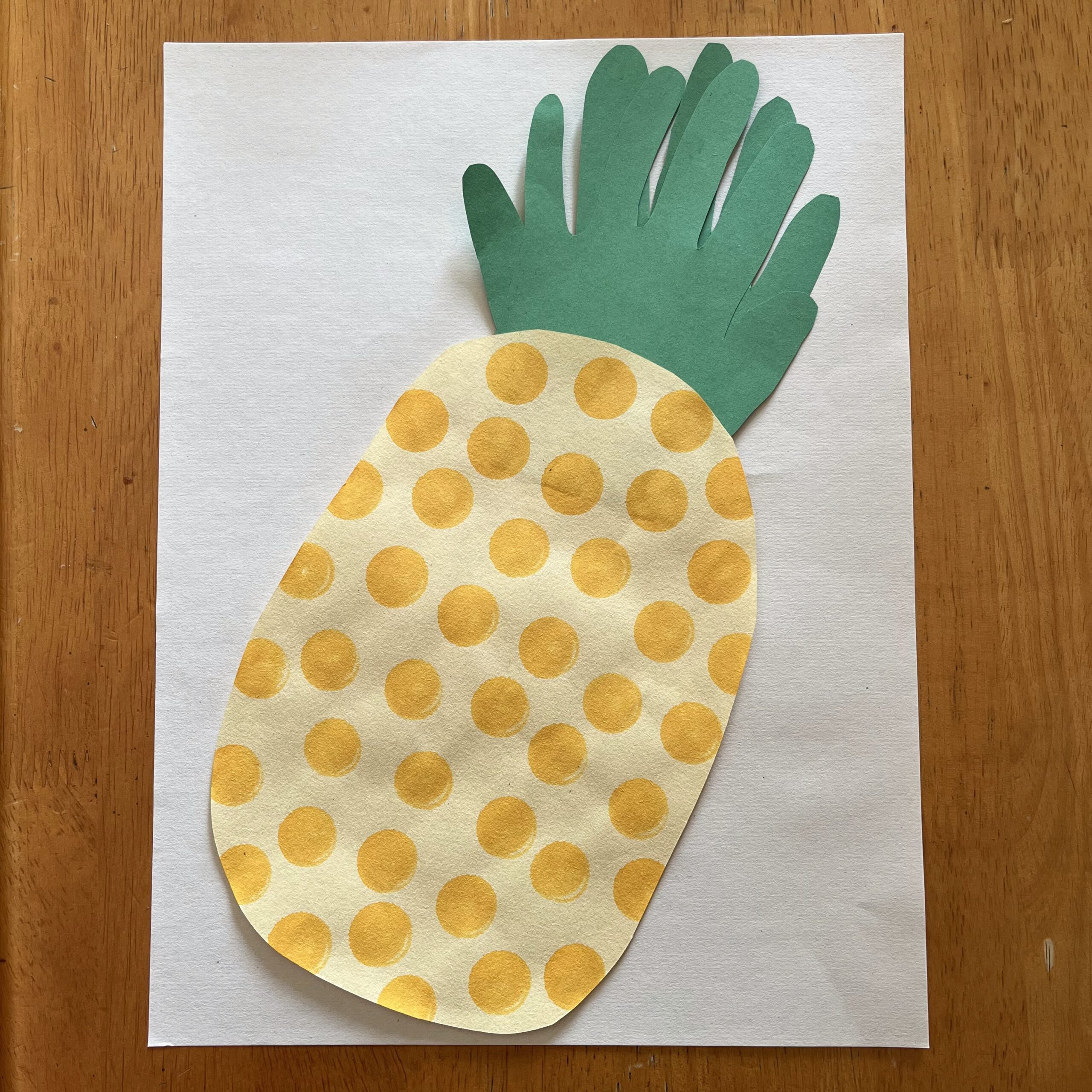 polkadot pineapple craft with handprint leaves