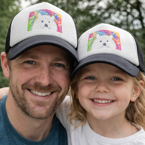 Father and daughter wearing matching Trucker Hats