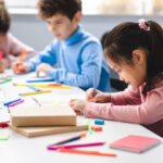 school children coloring